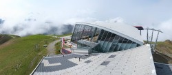 Archived image Webcam Axamer Lizum: Hoadl-Haus und Top station Olympiabahn 12:00