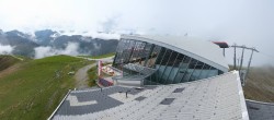 Archived image Webcam Axamer Lizum: Hoadl-Haus und Top station Olympiabahn 13:00