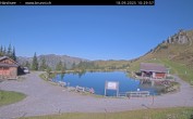 Archived image Webcam Engelberg: Lake Härzlisee & mountain restaurant Kräuterhütte 09:00