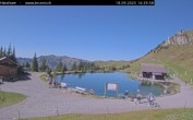 Archived image Webcam Engelberg: Lake Härzlisee & mountain restaurant Kräuterhütte 13:00
